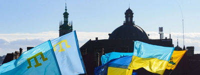 Ukrainian and Crimean Tatar flags are seen in downtown Lviv, Ukraine, on February 19, 2022, during a Unity march. The event showed the readiness of Ukrainians to resist Russian aggression.