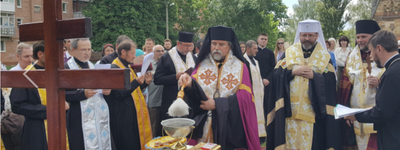 Archbishop Ihor Isichenko, center, along with Major Archbishop Sviatoslav Shevchuk, right, bless the cornerstone of a new church in 2018.