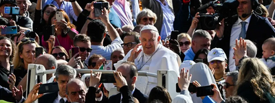  Pope Francis waves to attendees as he arrives in the popemobile car for the weekly general audience at St. Peter’s square in the Vatican, on Wednesday.