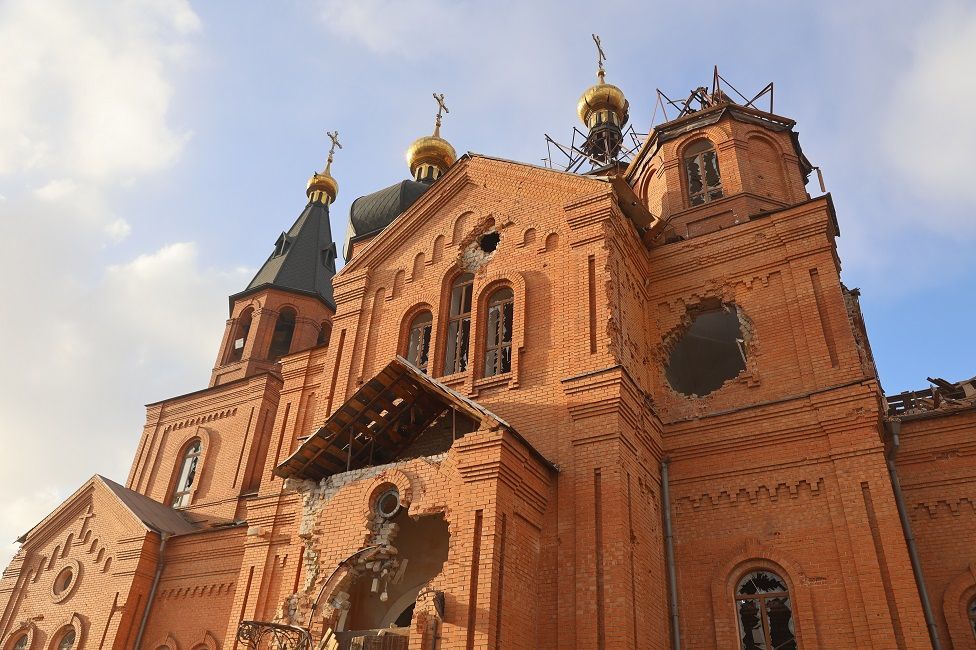 The church's windows are shattered, its dome torn off, and its brickwork blasted apart - фото 90769